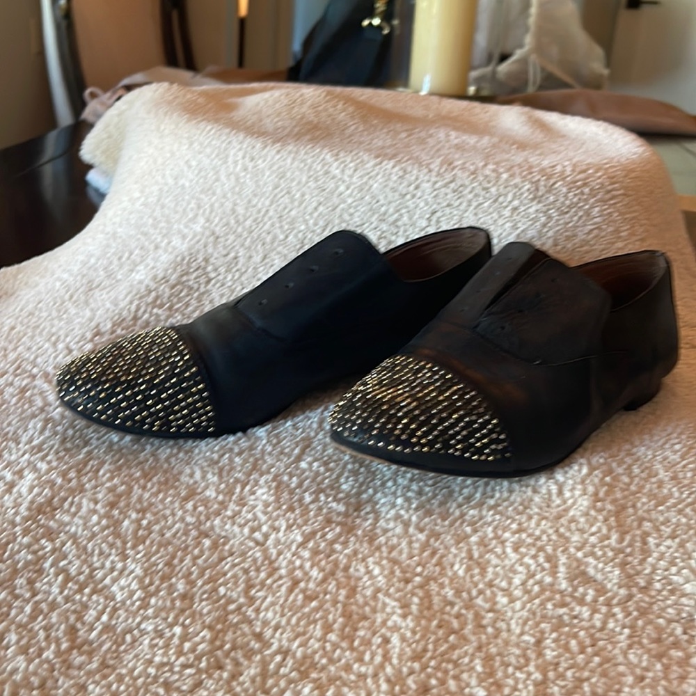Black leather small grommet flats